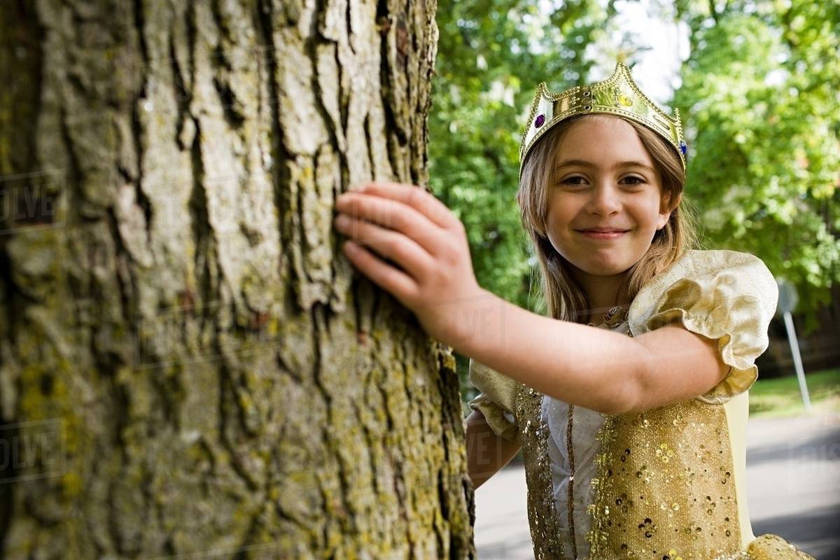 Girl wearing crown dressed up as queen Stock Photo Dissolve