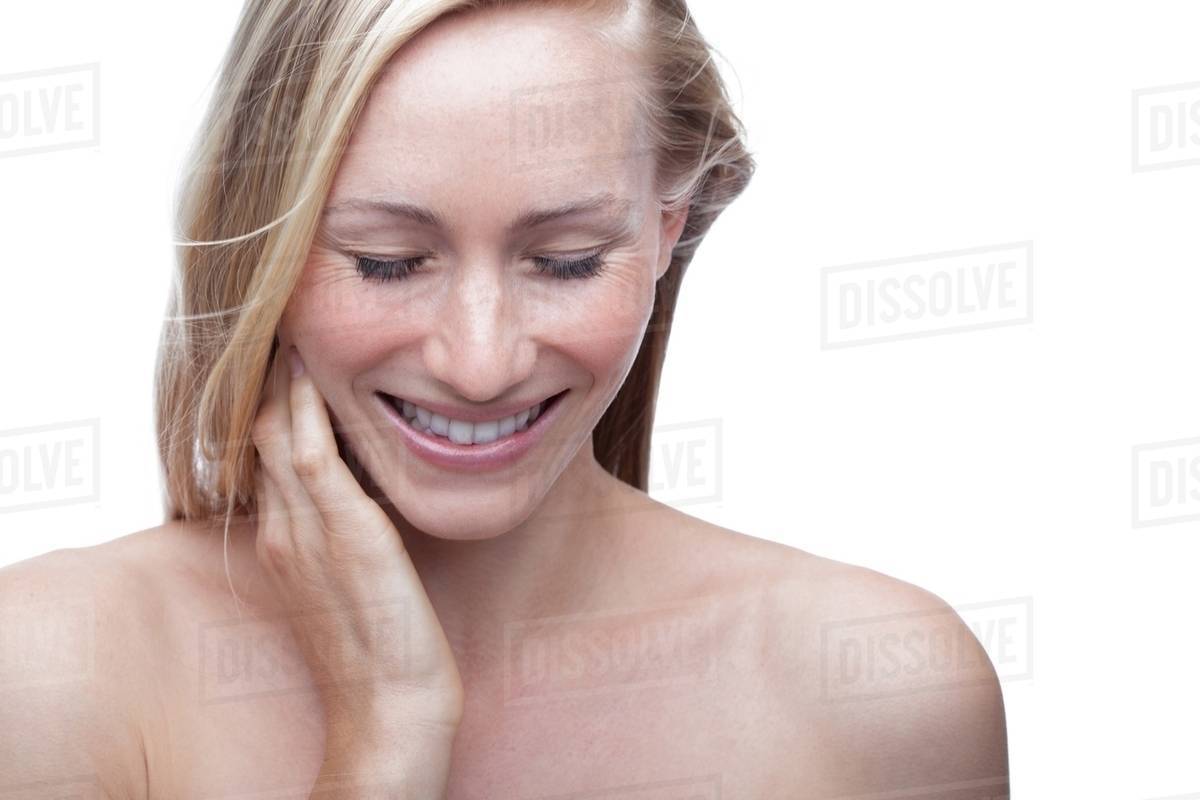 Young woman touching neck Stock Photo Dissolve