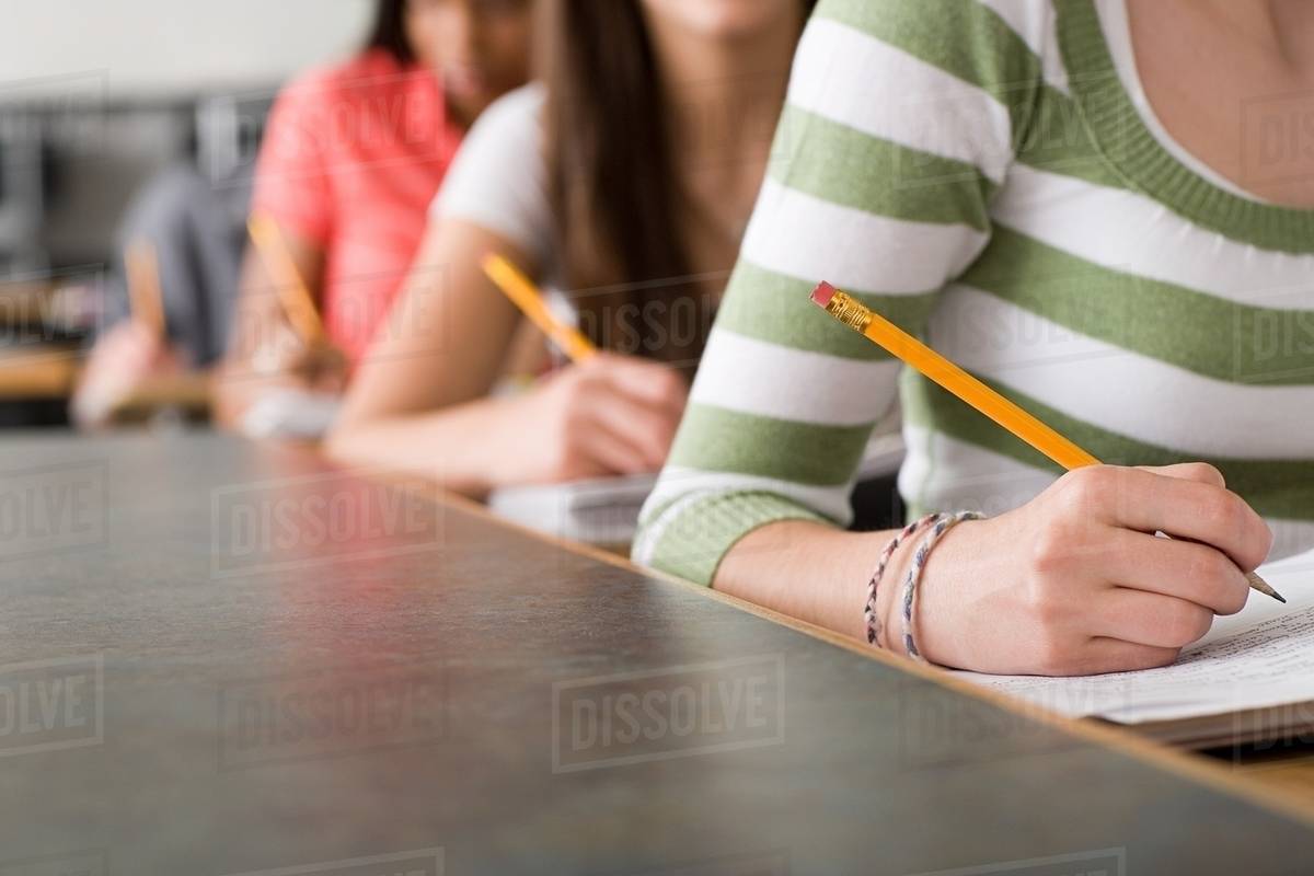 High school students writing Stock Photo Dissolve