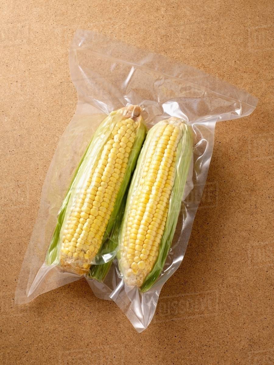 Vacuum packed sweetcorn Stock Photo Dissolve