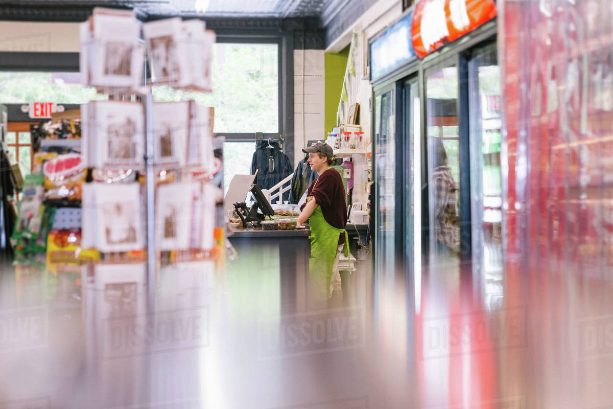 Clerk in general store, Hague, USA Stock Photo Dissolve