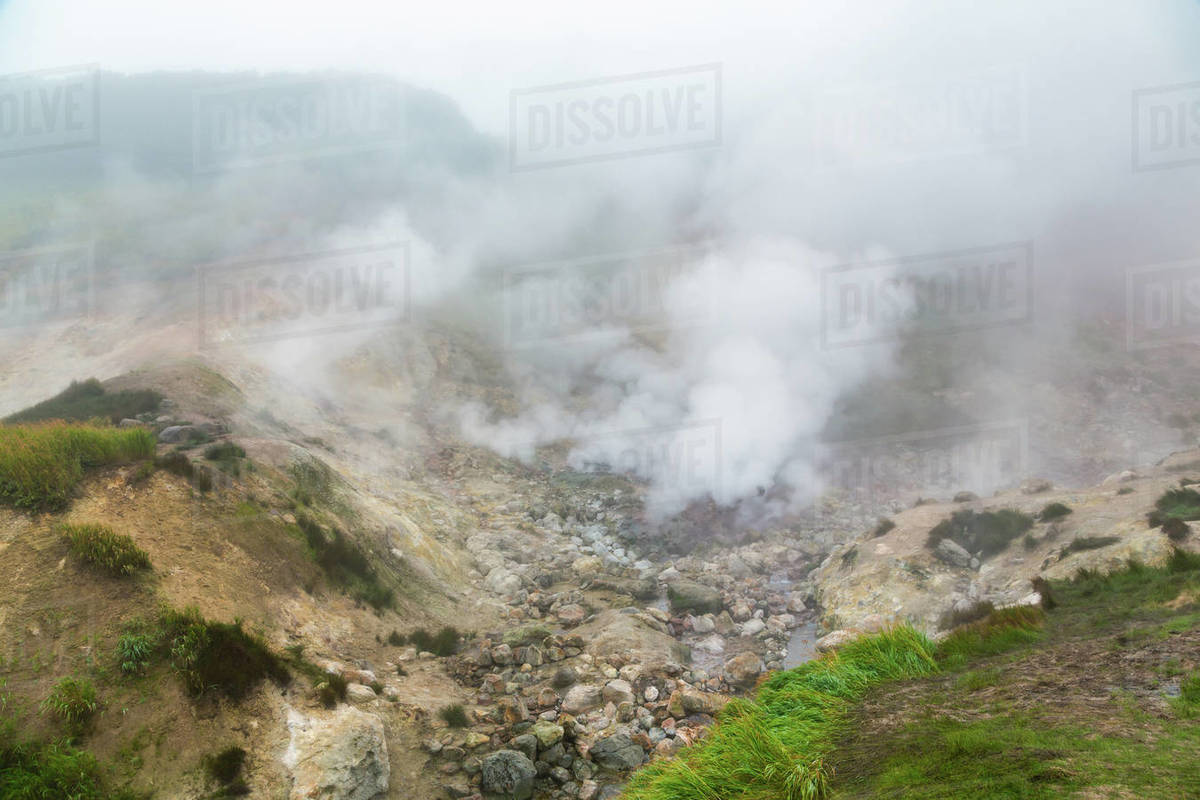 Mysterious view of volcanic landscape, aggressive hot spring, erupting