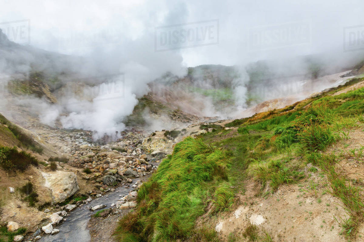 Picturesque view of volcanic landscape, aggressive hot spring, erupting