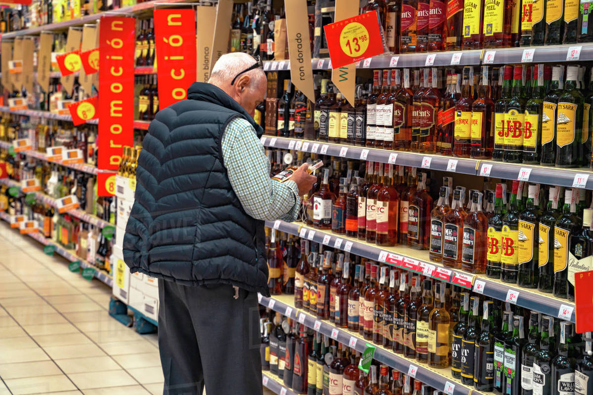 Valencia,Spain April 27, 2019 Man choosing alcohol beverage