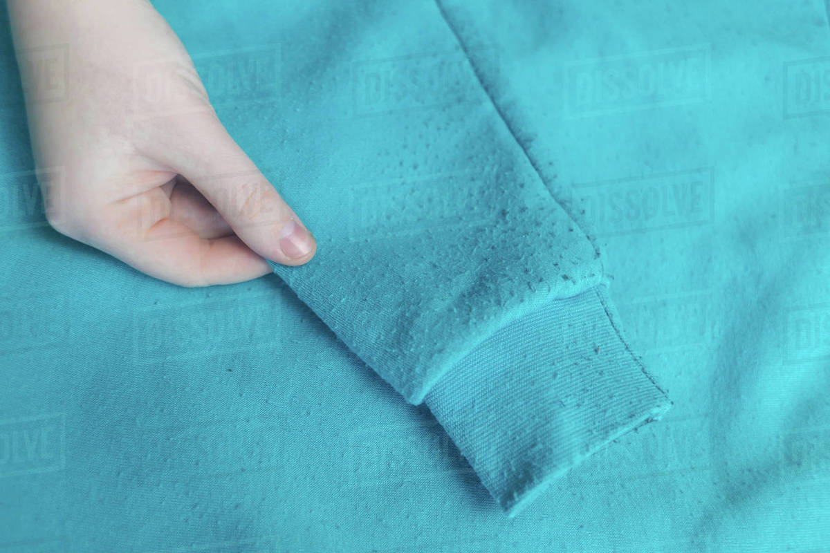 Machine for removing pellets. The girl uses a special device to remove