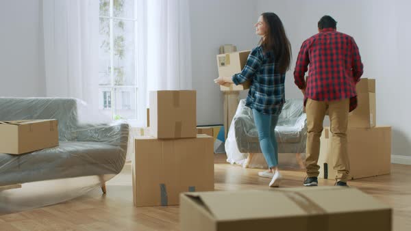 Very Hy Man Moves Into His New Apartment Dances Excitedly Hy Young Moving Into New Apartment Carrying Cardboard Boxes With Stuff Having Fun