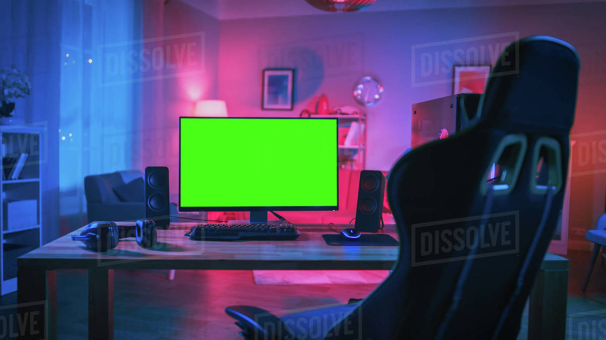 Powerful personal computer gamer rig with mock up green screen monitor