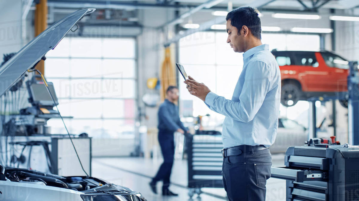 Car Service Manager Uses a Tablet Computer with an Augmented Reality