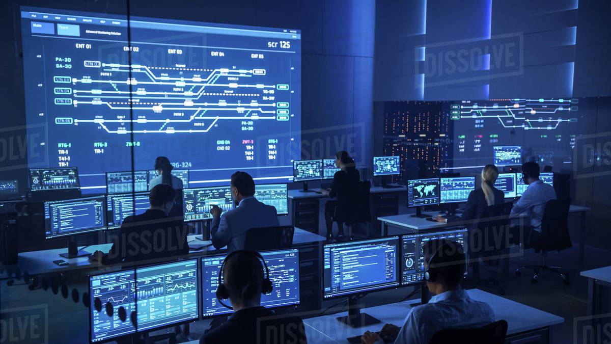 Team of Professional Computer Data Science Engineers Work on Desktops