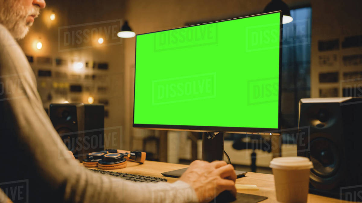 Creative Middle Aged Designer Sitting at His Desk Uses Desktop Computer