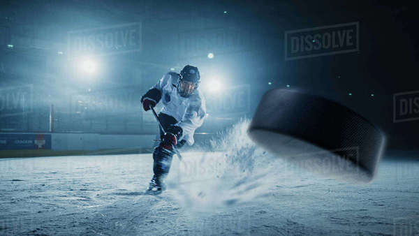 Ice Hockey Rink Arena: Professional Player Shooting the Puck with ...