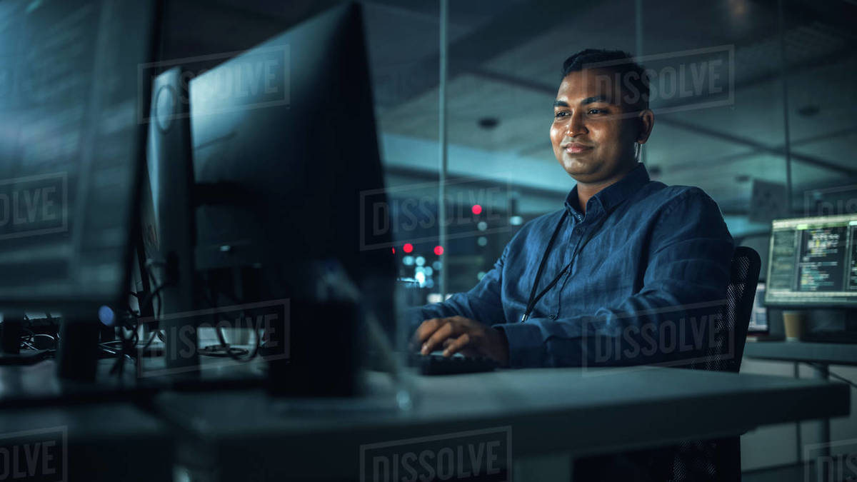 Professionals Using Computers in an Office Stock Photo Dissolve