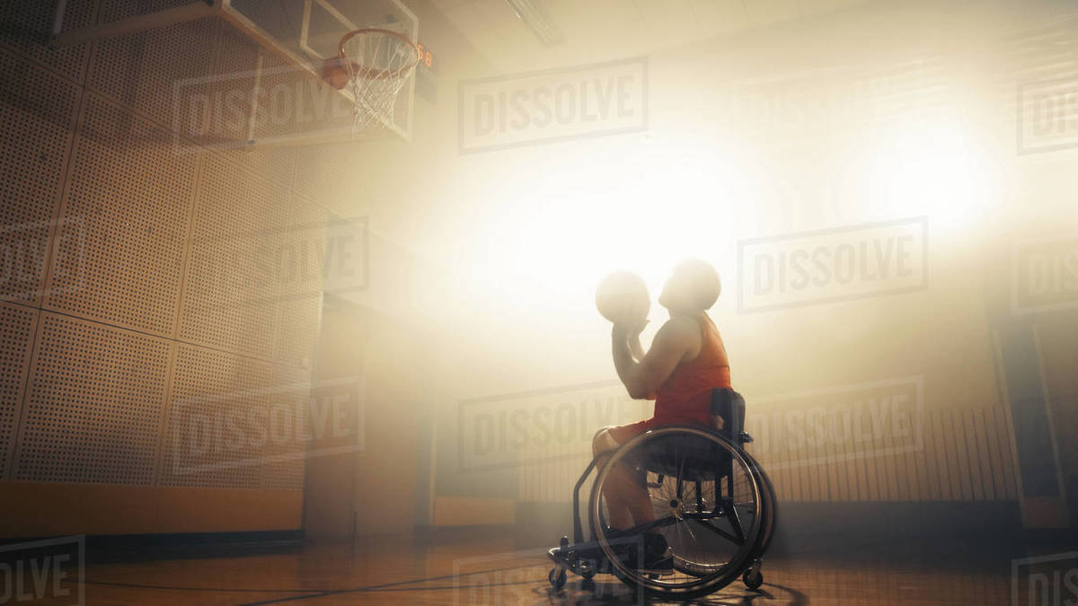 Portrait of Wheelchair Basketball Player Shooting Ball to Score a