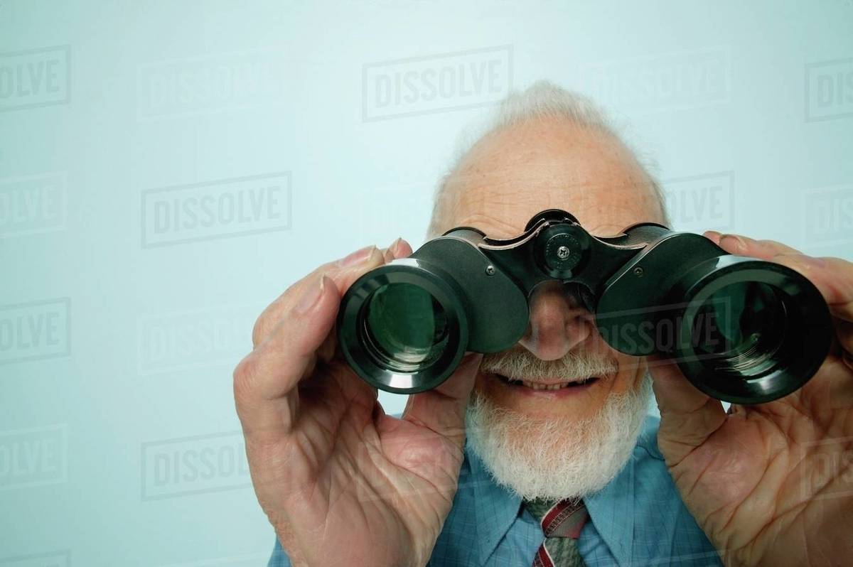 Senior Looks Through Binoculars Stock Photo Dissolve