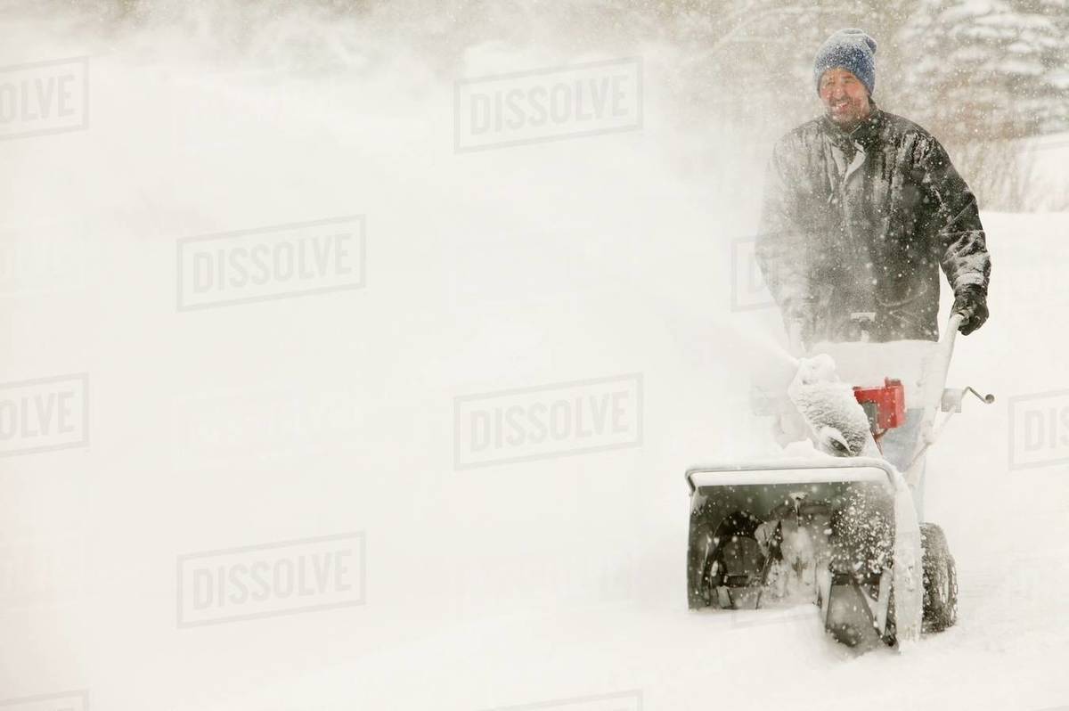 A Man SnowBlowing Stock Photo Dissolve