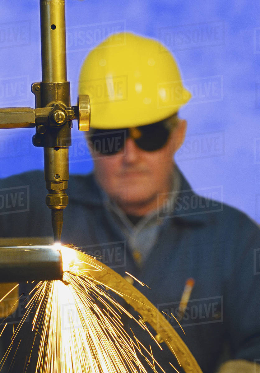 Construction Worker Monitoring Steel Cutter Stock Photo Dissolve