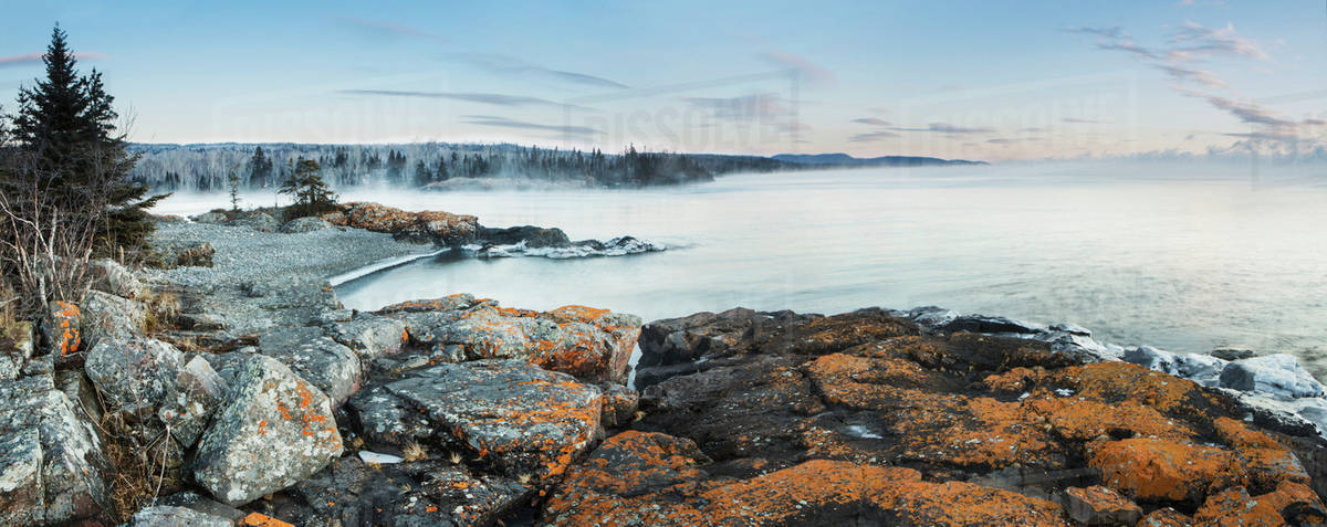 Fog over Lake Superior with ice on the rocks; Thunder Bay, Ontario, Canada Royalty-free stock photo