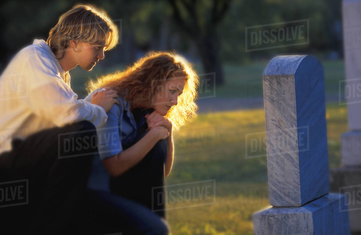 Visiting A Grave Stock Photo Dissolve