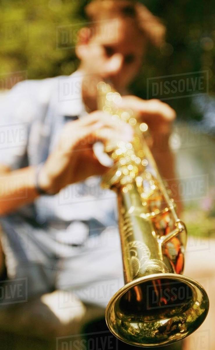 Young Man Plays Soprano Saxophone Stock Photo Dissolve