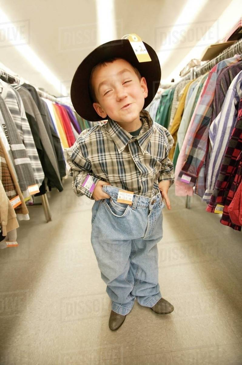 Child Tries On Clothes Stock Photo Dissolve
