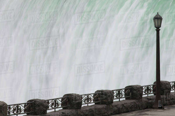 Railing and lamp post with the Horseshoe Falls in the background at ...