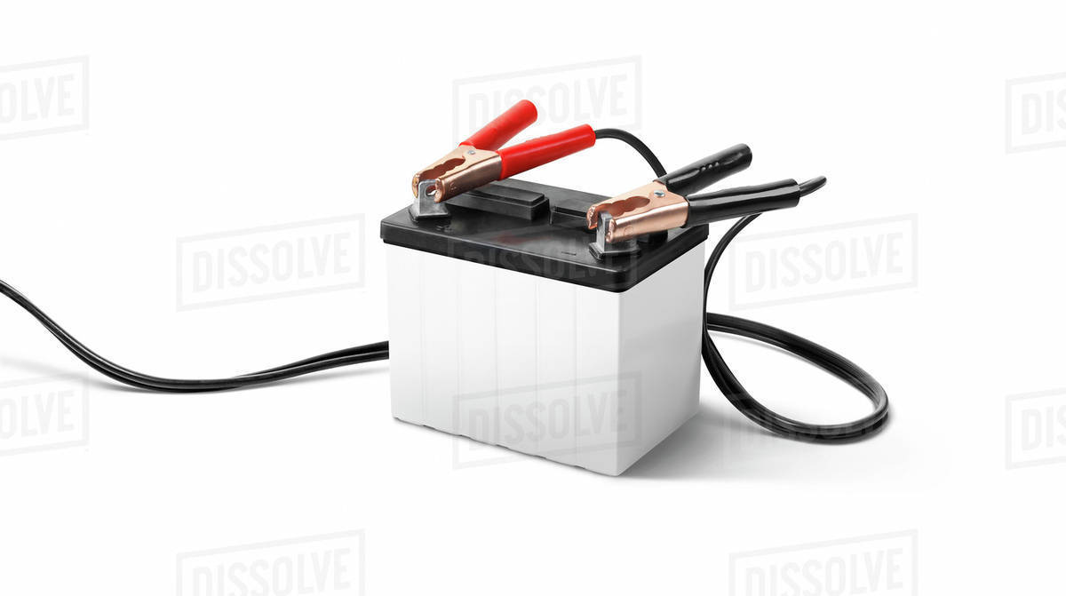 Booster cables on a car battery Stock Photo Dissolve