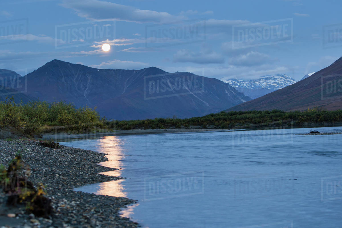 Moonlight reflected into noatak river in the brooks range gates of the