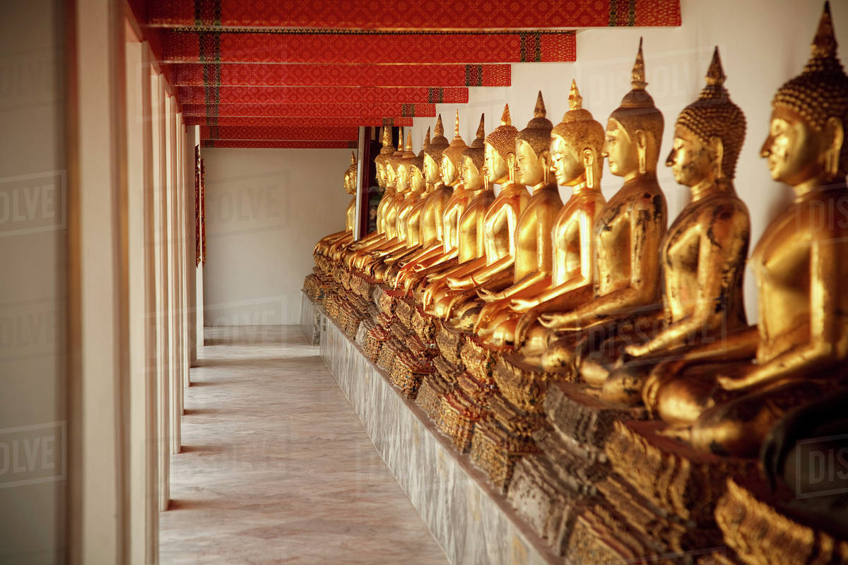 Seated Golden Buddha Statues In A Row At Wat Pho, Temple Of The