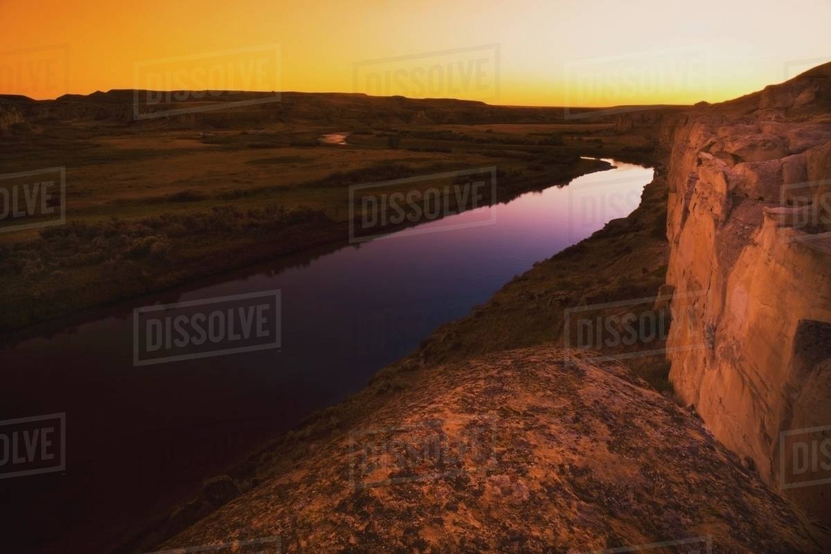 Alberta, Canada; Milk River At Sunset Stock Photo Dissolve