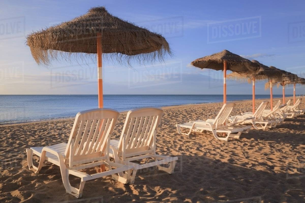 Sun Umbrellas And Beach Chairs On A In Costa Del Sol Sun Umbrellas And Beach Chairs On A In Costa Del Sol Torremolinos Malaga Andalusia Spain