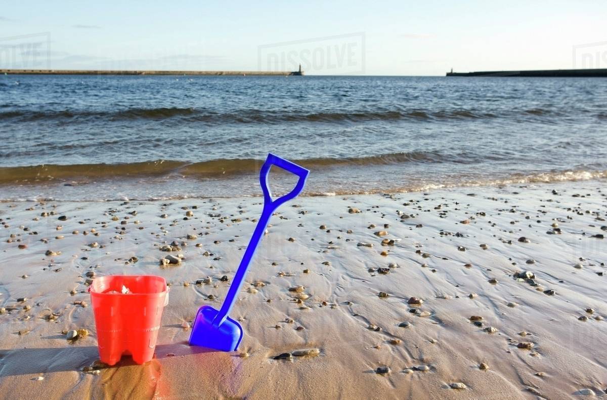 Bucket And Shovel On Beach Stock Photo Dissolve