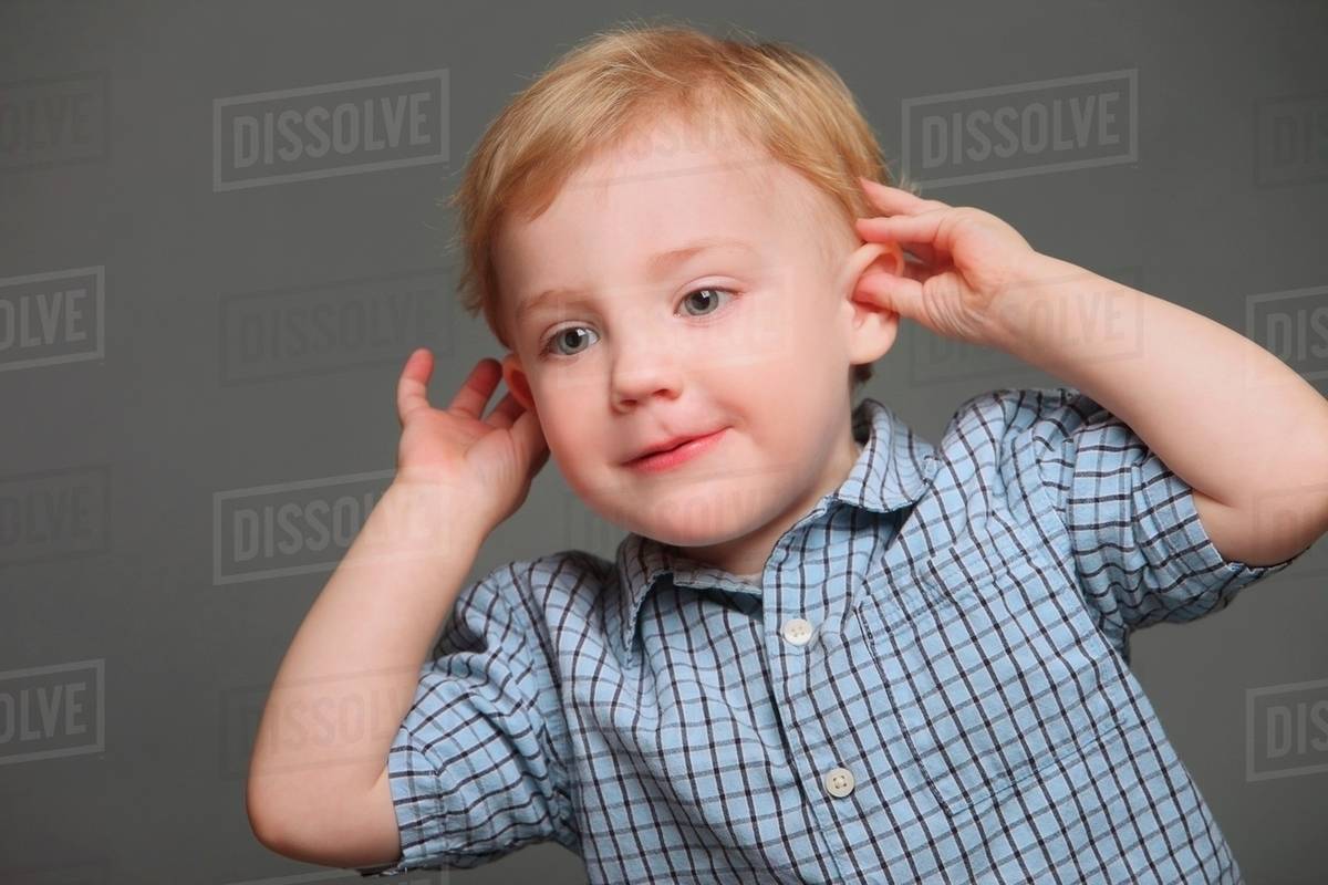 Boy Pulling His Ears Stock Photo Dissolve