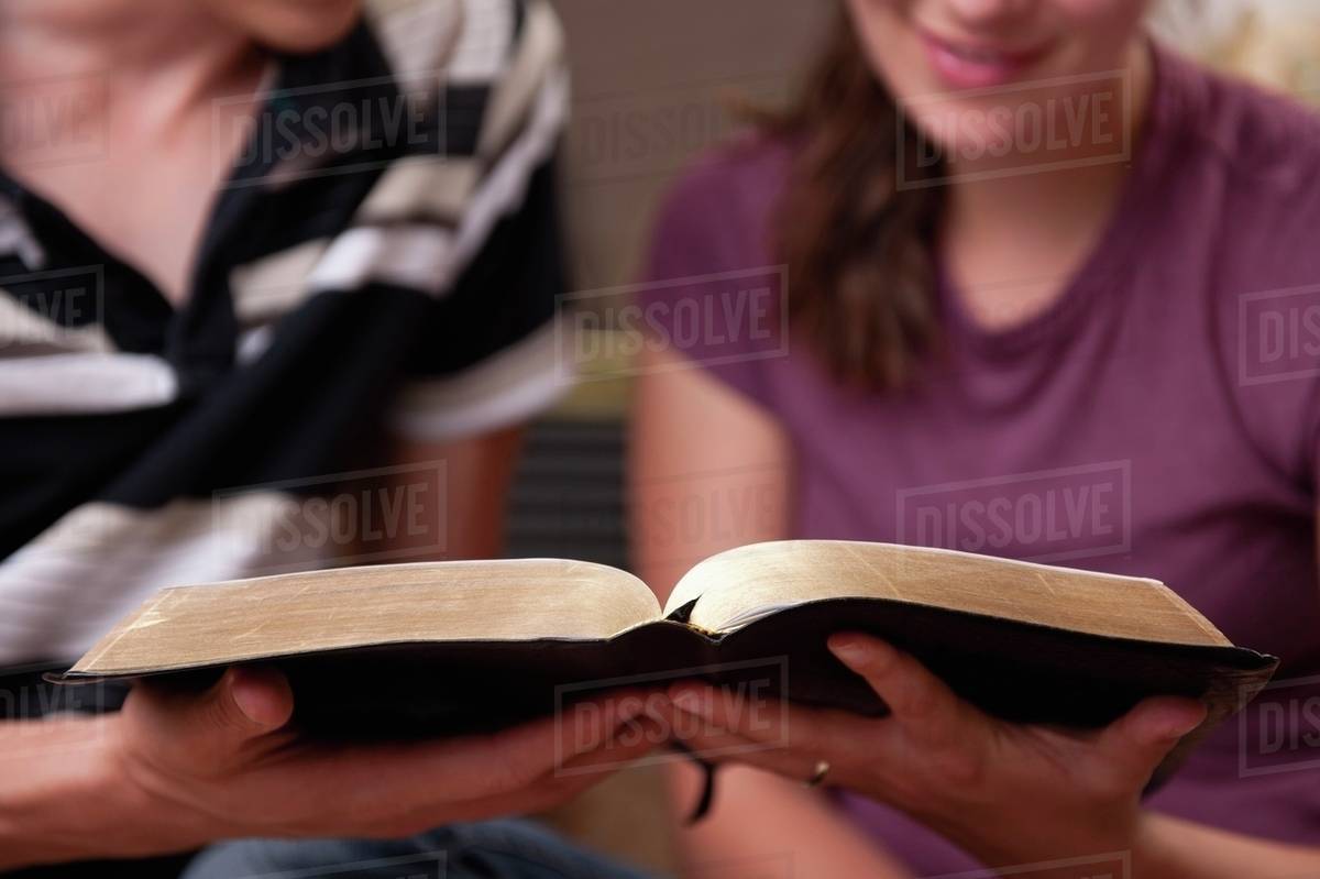 A Couple Reading The Bible Stock Photo Dissolve