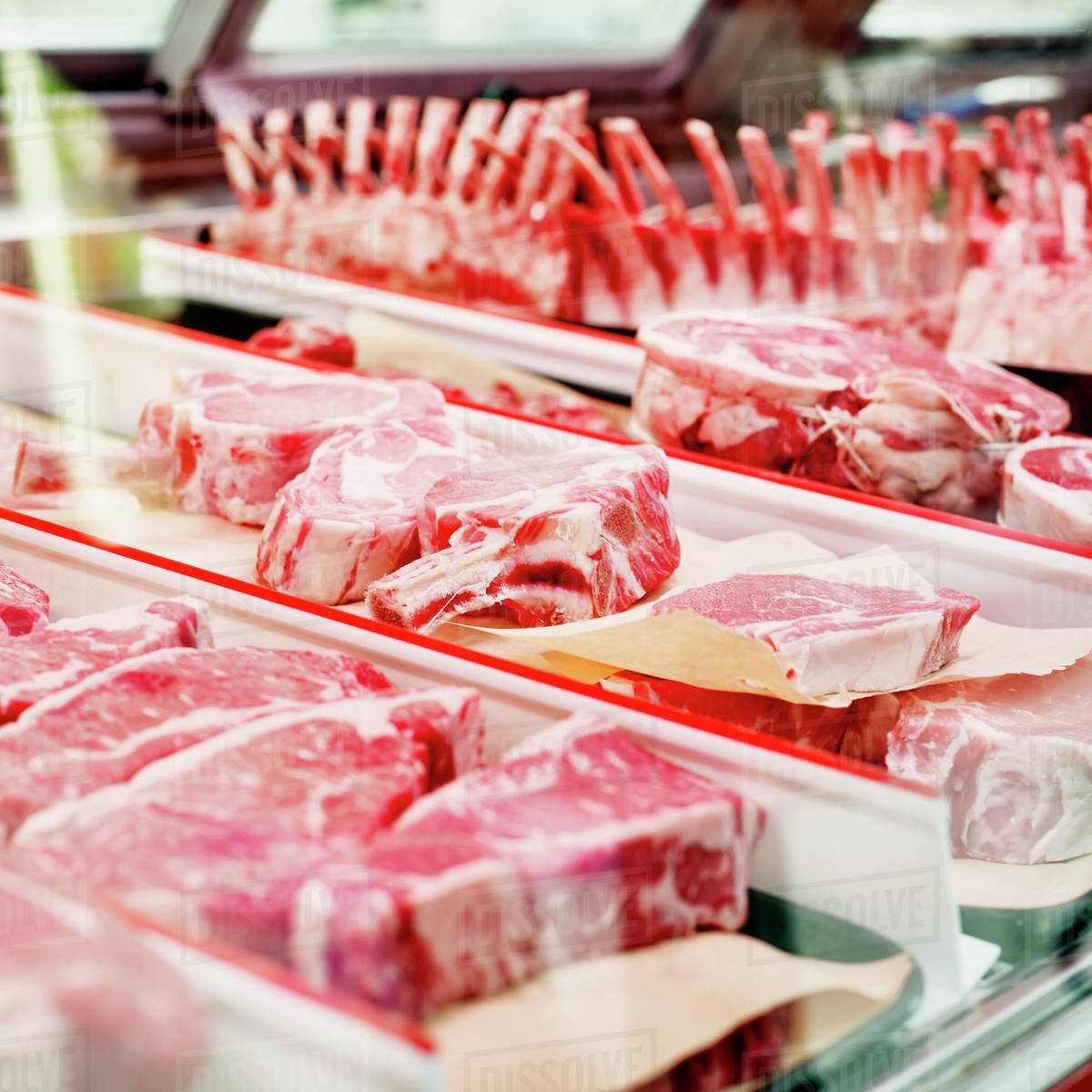 Raw meat counter at butcher shop; Ontario, Canada Stock Photo Dissolve