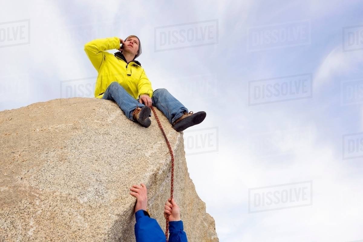 Climber belaying fellow climber Stock Photo Dissolve