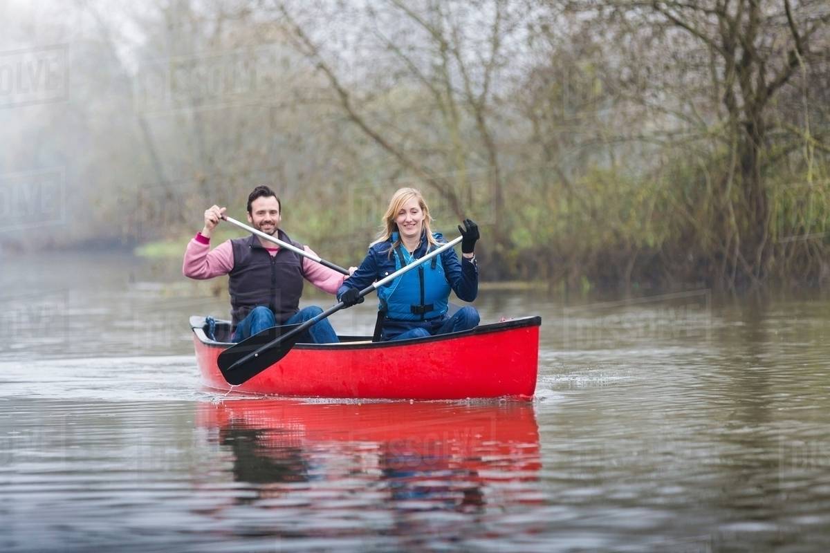 Couple canoeing Stock Photo Dissolve