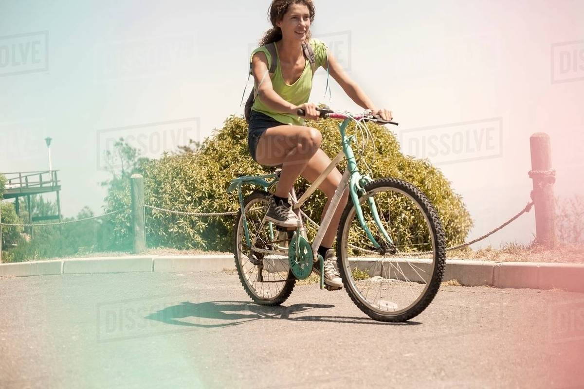 young woman riding bicycle