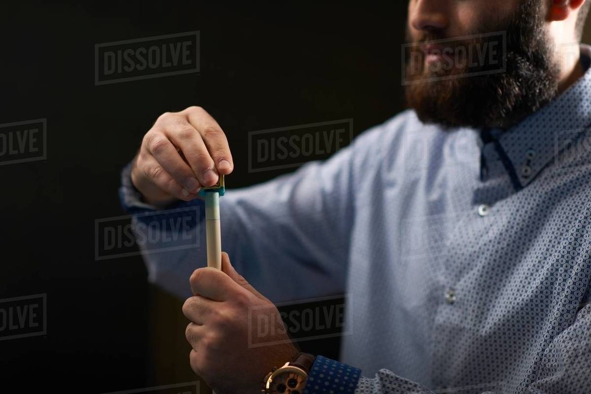Man chalk rubbing pool cue Stock Photo Dissolve