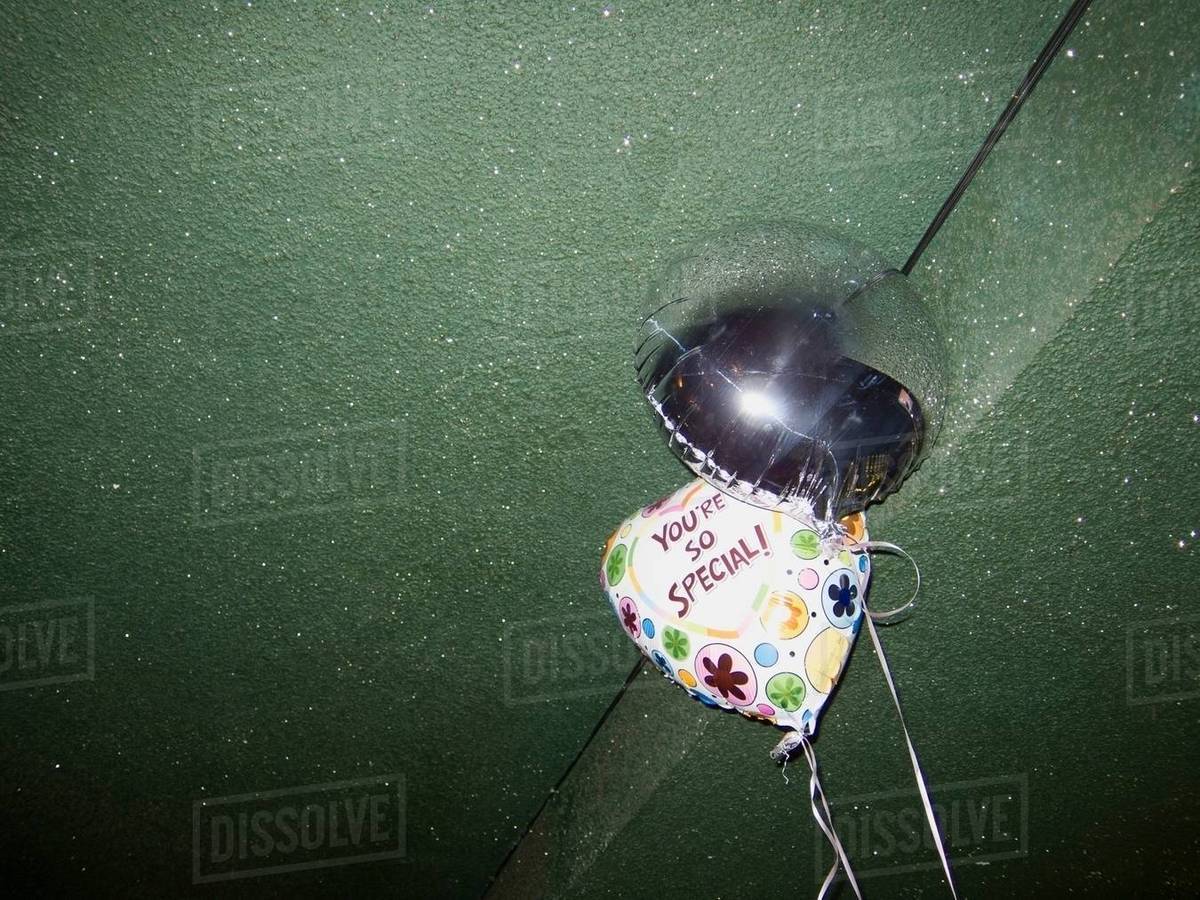 Helium Balloons And Green Ceiling Stock Photo Dissolve