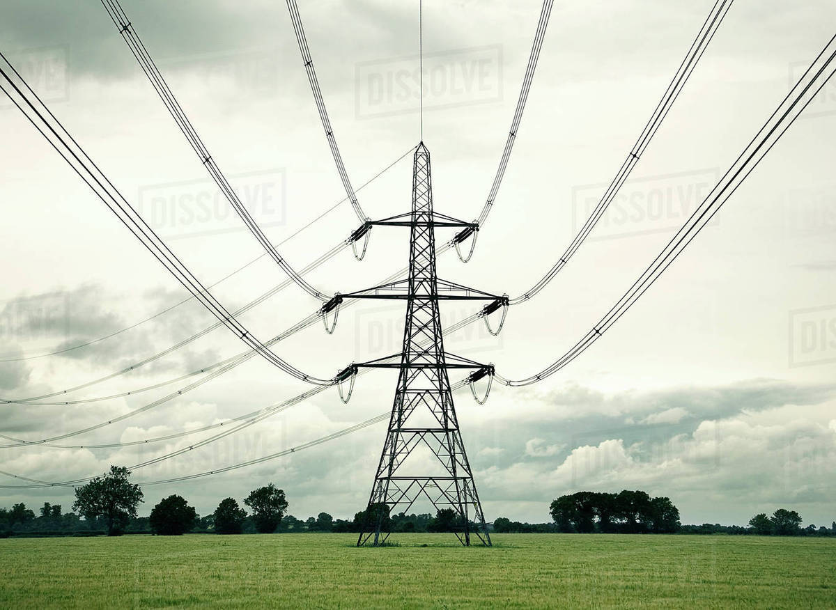 Electrical pylon in rural field Stock Photo Dissolve