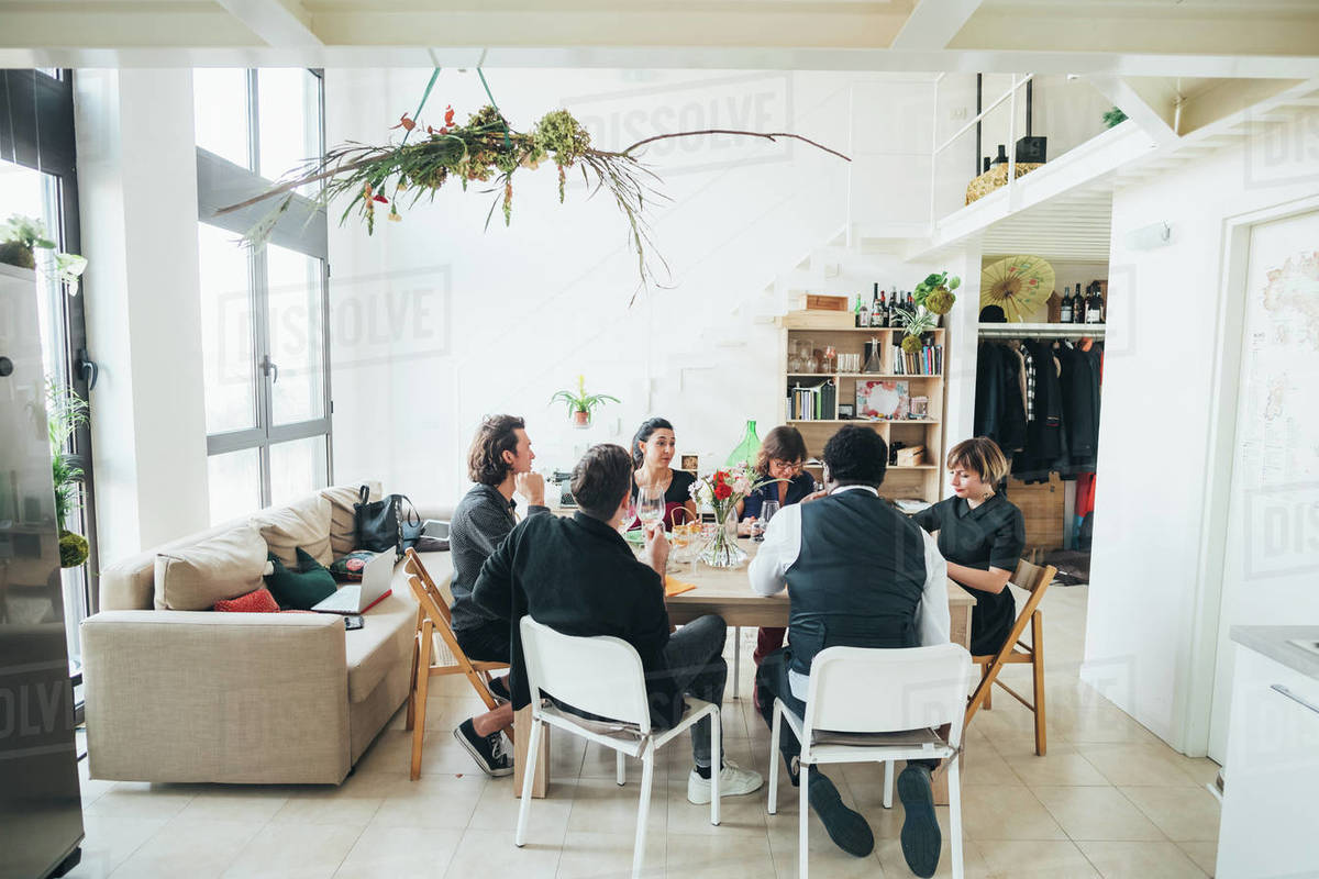 Businessmen and businesswomen celebrating at lunch party in loft office Royalty-free stock photo