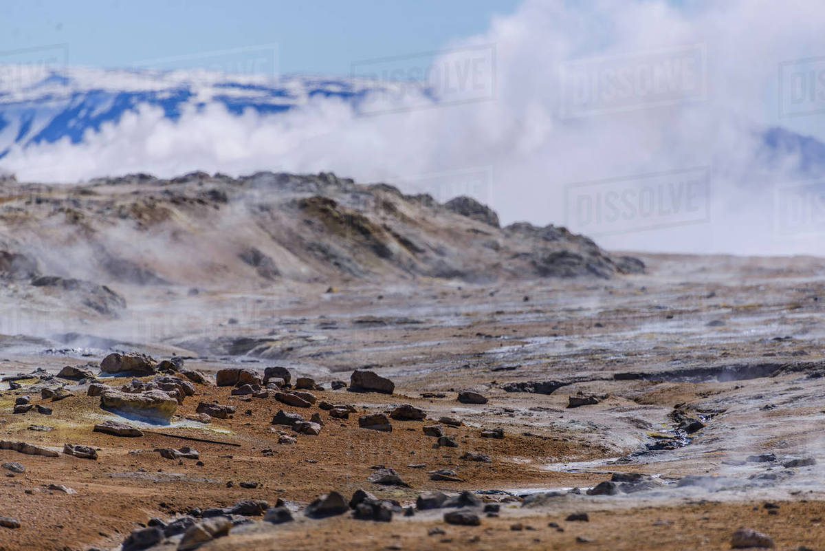 Barren landscape with steam rising beyond rocks, Akureyri, Eyjafjardarsysla, Iceland Royalty-free stock photo