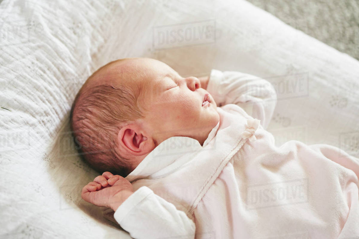 Baby Sleeping On U Shaped Pillow At Home Stock Photo Dissolve