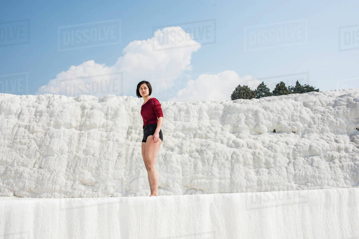 Woman enjoying cotton castle, Pamukkale, Denizli, Turkey Royalty-free stock photo