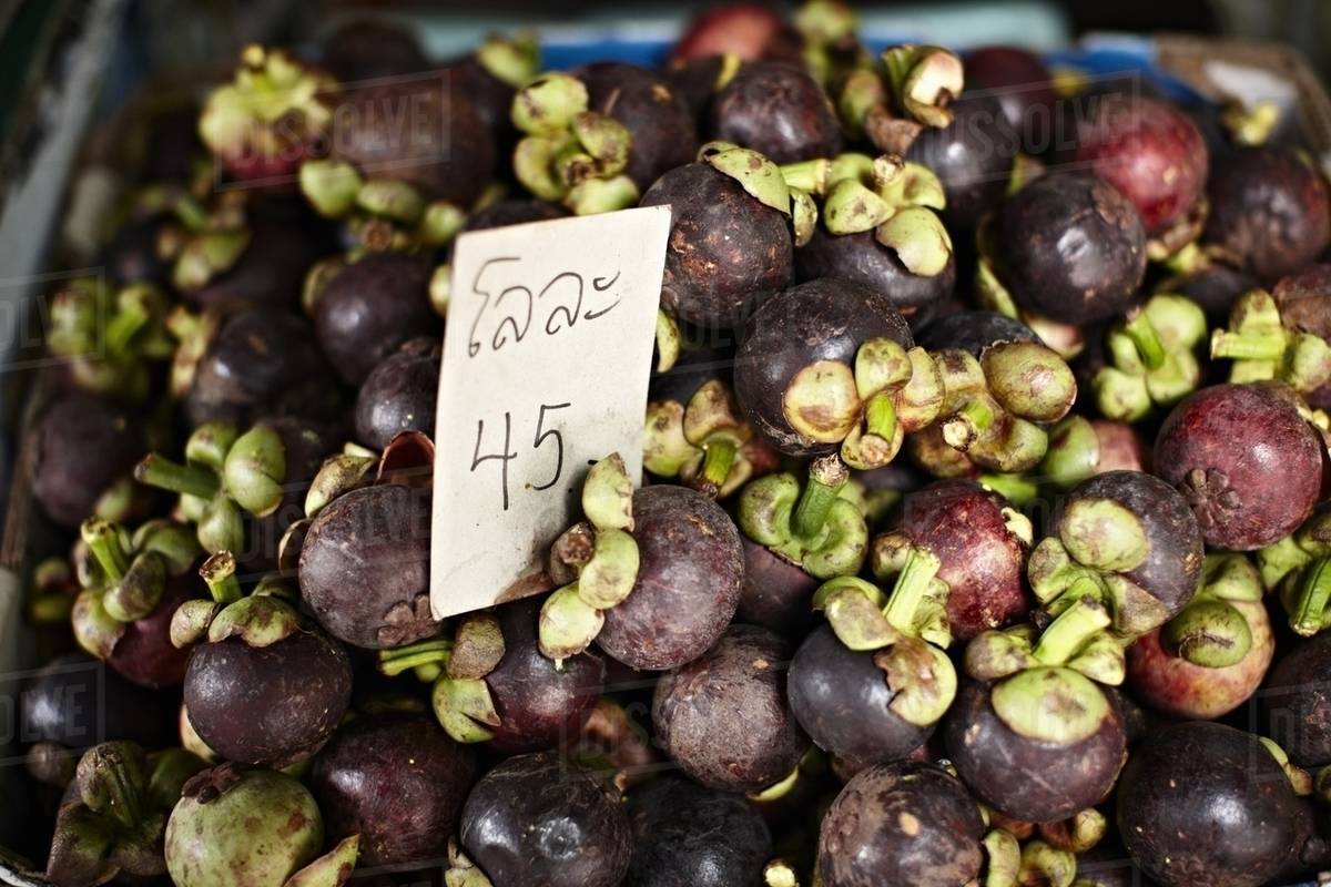 Mangosteen for sale at market Stock Photo Dissolve