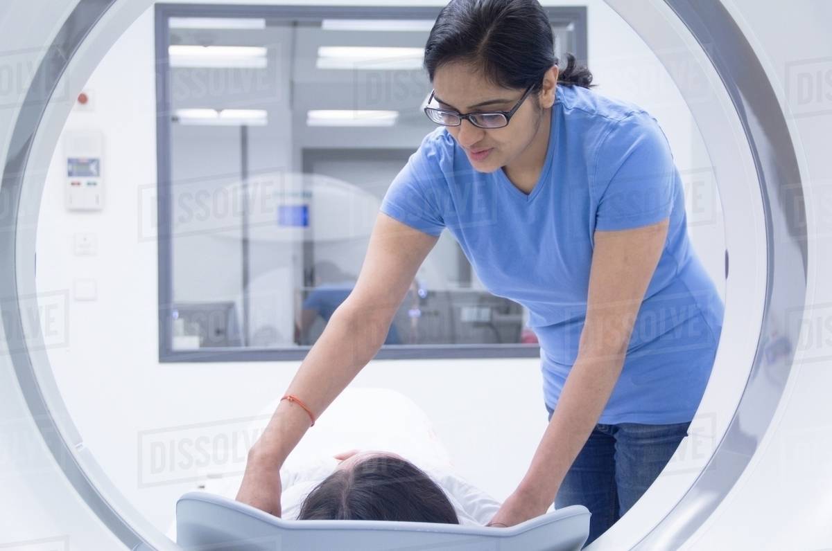 technician-with-patient-in-ct-scanner-stock-photo-dissolve