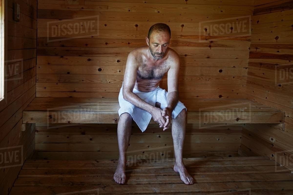 Mature man relaxing in sauna with head image
