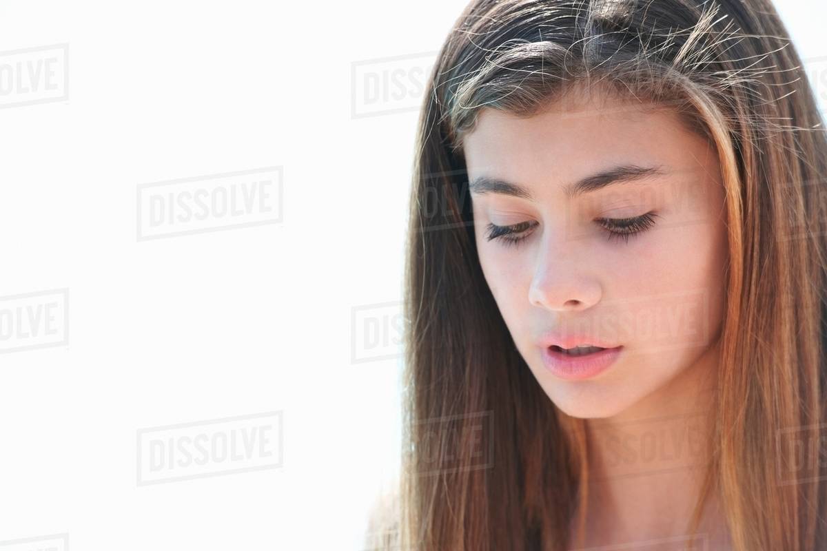 Portrait of teenage girl looking down Stock Photo Dissolve