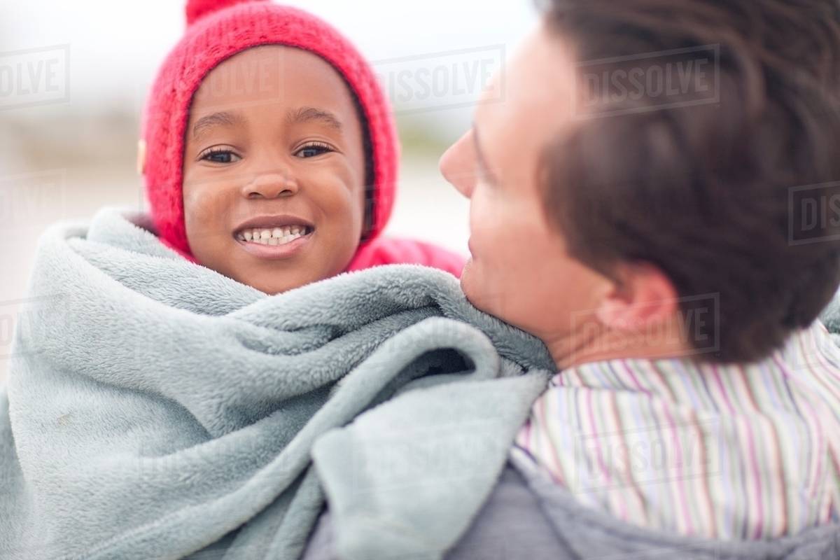 child wrapped in blanket