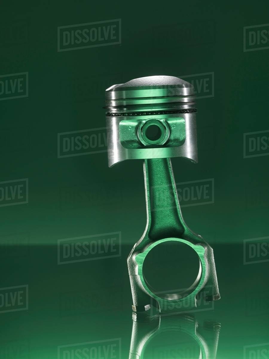Car piston on green background Stock Photo Dissolve